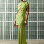 Model wearing a lime green KABE SHOP INC Ravenna mini dress with sculpted draping and an asymmetric sash skirt.