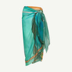 KABE SHOP INC Magdalena Pareo in lightweight teal fabric with an expressive landscape print for beach and resort wear.
