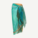 KABE SHOP INC Magdalena Pareo in lightweight teal fabric with an expressive landscape print for beach and resort wear.