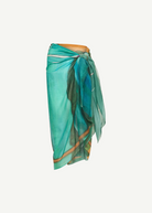 KABE SHOP INC Magdalena Pareo in lightweight teal fabric with an expressive landscape print for beach and resort wear.