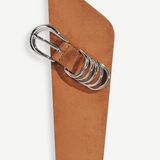 KABE SHOP INC Alcott suede belt in tan with asymmetrical shape and signature silver five-ring hardware detail.
