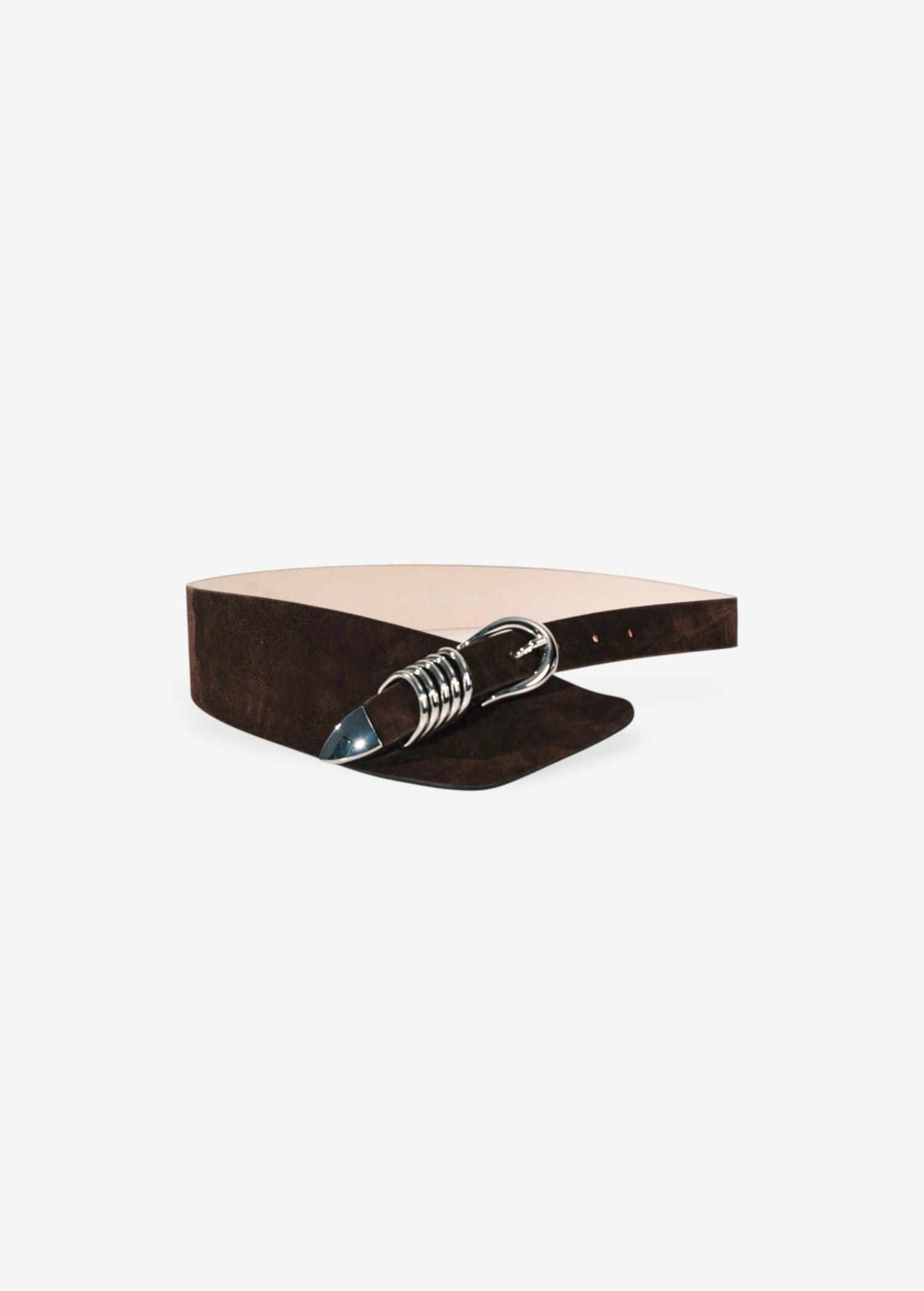 KABE SHOP INC Alcott brown suede belt featuring an asymmetrical design and signature silver five-ring hardware.