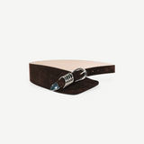KABE SHOP INC Alcott brown suede belt featuring an asymmetrical design and signature silver five-ring hardware.