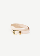 KABE SHOP INC Altura belt in cream Italian calfskin leather with a polished gold curved buckle on a neutral background