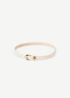 KABE SHOP INC Altura belt in cream Italian calfskin leather with a polished gold curved buckle on a neutral background