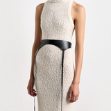 Model wearing KABE SHOP INC Laisse black Italian calfskin garter belt over a textured cream knit sleeveless dress