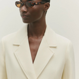 KABE SHOP INC Valentina oval sunglasses in tortoiseshell acetate worn by a model in a cream blazer