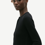 KABE SHOP INC Valentina oval sunglasses in translucent beige acetate worn by a model in a black sweater