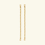 Two pieces from the Lola Swimwear collection, featuring gold chain earrings with small heart-shaped hooks at each end reminiscent of delicate jewelry straps, are displayed vertically against a plain, light beige background.