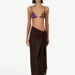 Model wearing KABE SHOP INC Dolores Top Classic in purple and yellow plaid with a brown sarong and jewelry straps