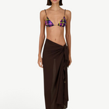 Model wearing KABE SHOP INC Dolores Top Classic in purple and yellow plaid with a brown sarong and jewelry straps