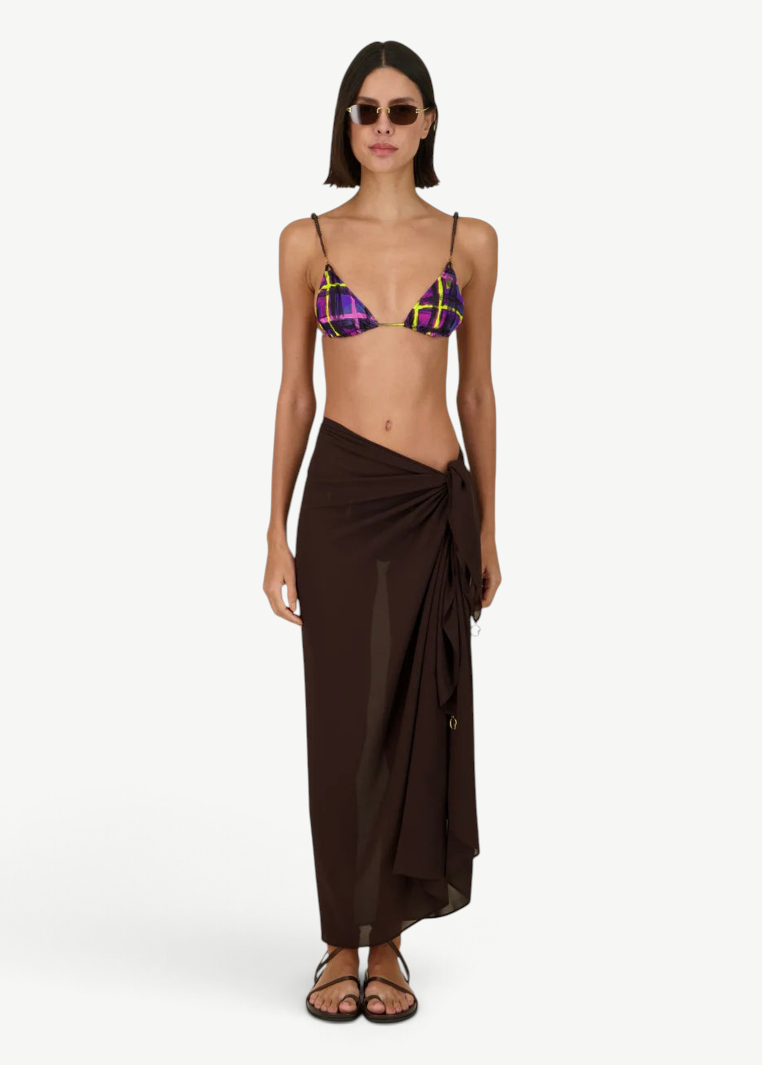 Model wearing KABE SHOP INC Dolores Top Classic in purple and yellow plaid with a brown sarong and jewelry straps