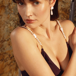 KABE SHOP INC Maui Straps featuring freshwater pearls and palladium-plated metal worn on a black swimsuit