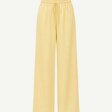 Pale yellow Damian Pant with a wide-leg silhouette and an elastic drawstring waistband, offering a versatile wardrobe staple for a polished style.
