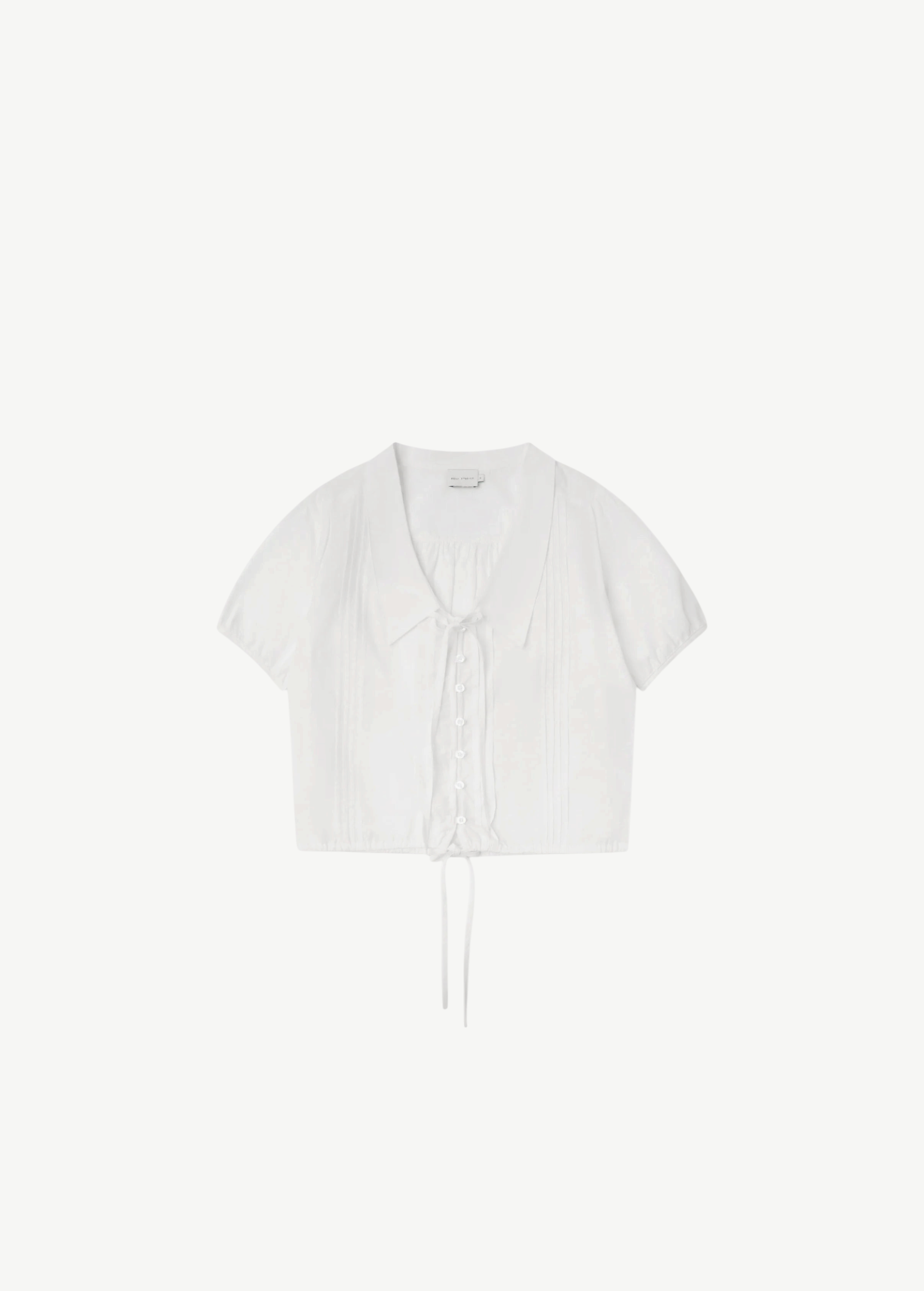 KABE SHOP INC Deiji Studios white cotton poplin top with collared V-neck, pintuck details, and drawcord hem.