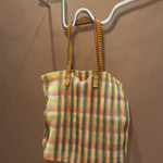KABE SHOP INC Kanpur bag featuring a vibrant multi-colored mesh plaid pattern with striped fabric handles.