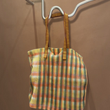 KABE SHOP INC Kanpur bag featuring a vibrant multi-colored mesh plaid pattern with striped fabric handles.