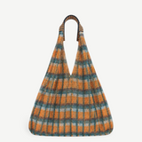 KABE SHOP INC Udaipur bag featuring a vibrant orange and teal plaid mesh design with striped woven shoulder straps.