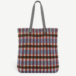 KABE SHOP INC Kanpur bag featuring a vibrant multi-colored plaid woven textile pattern and black striped handles.