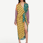 Model wearing KABE SHOP INC Estrellitas viscose shirt dress with a wrap design, knotted waist, and star print pattern.