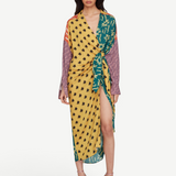 Model wearing KABE SHOP INC Estrellitas viscose shirt dress with a wrap design, knotted waist, and star print pattern.