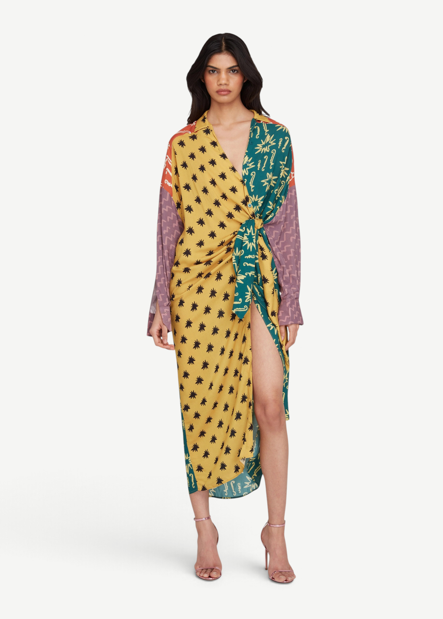 Model wearing KABE SHOP INC Estrellitas viscose shirt dress with a wrap design, knotted waist, and star print pattern.