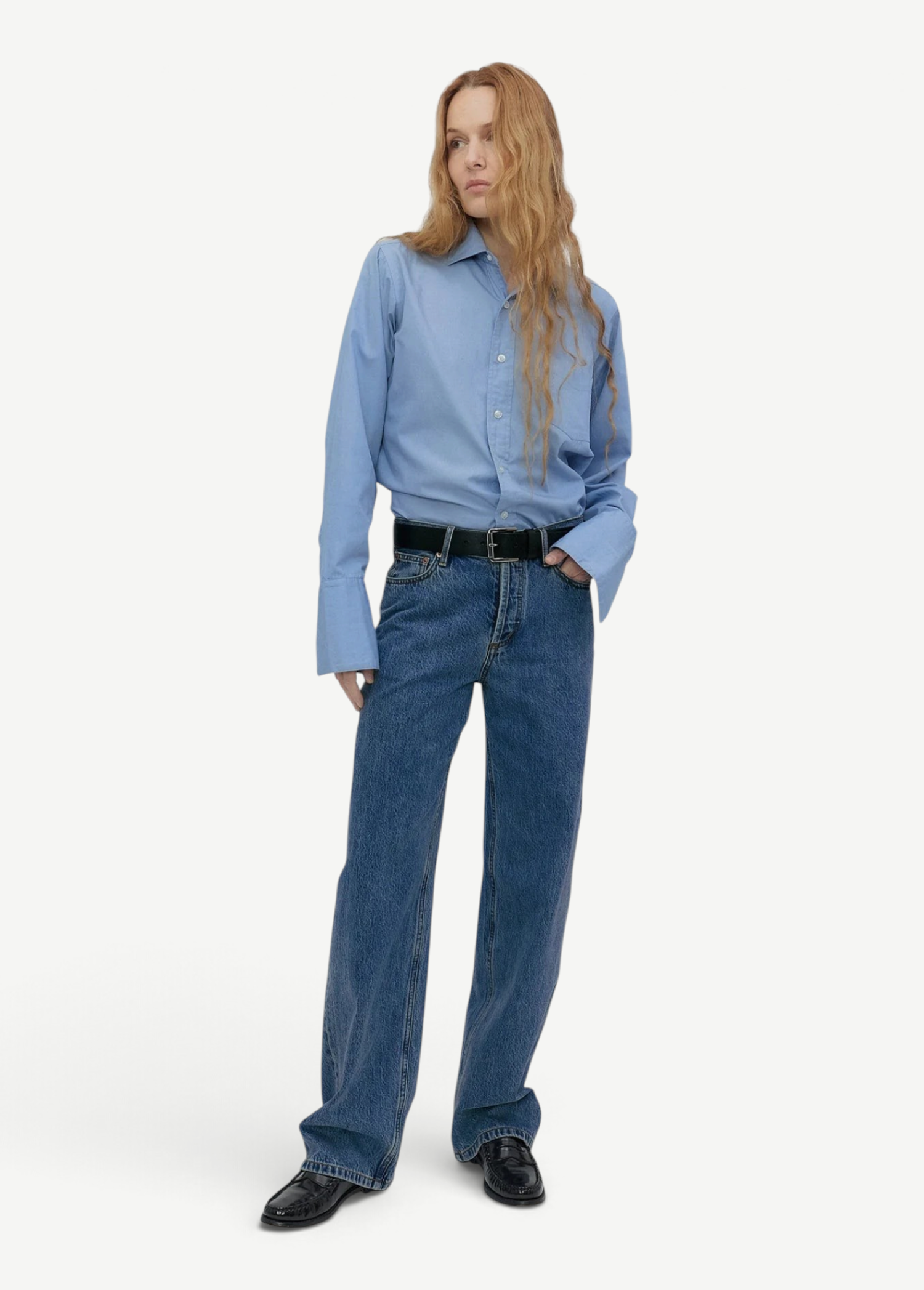 Model wearing KABE SHOP INC Everyday Jeans in medium blue denim with a relaxed straight-leg fit and black belt