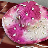 KABE SHOP INC Wika crochet hat in pink and white tie-dye featuring decorative cowrie shells and a chin strap