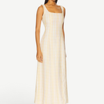 Model wearing a KABE SHOP INC Lenice midi dress in cream and yellow plaid linen with a square neckline