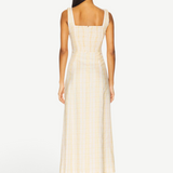 Back view of KABE SHOP INC Lenice midi dress in yellow plaid linen with a square neckline and smocked bodice