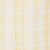 Close-up of KABE SHOP INC Lenice midi dress in lightweight white linen with a soft yellow plaid pattern.