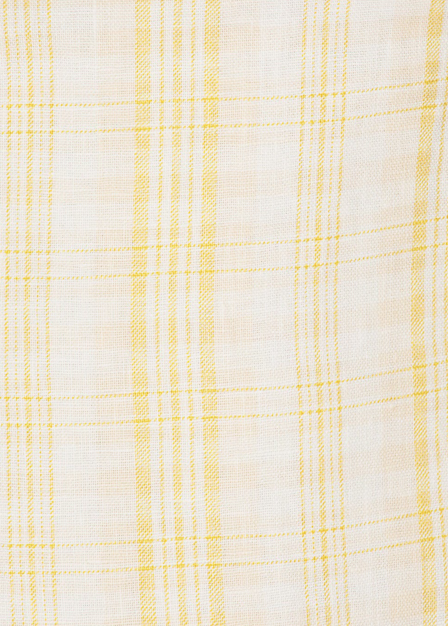 Close-up of KABE SHOP INC Lenice midi dress in lightweight white linen with a soft yellow plaid pattern.