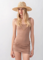 KABE SHOP INC straw fedora hat with cut-out design and gold double chain strap worn by a blonde model