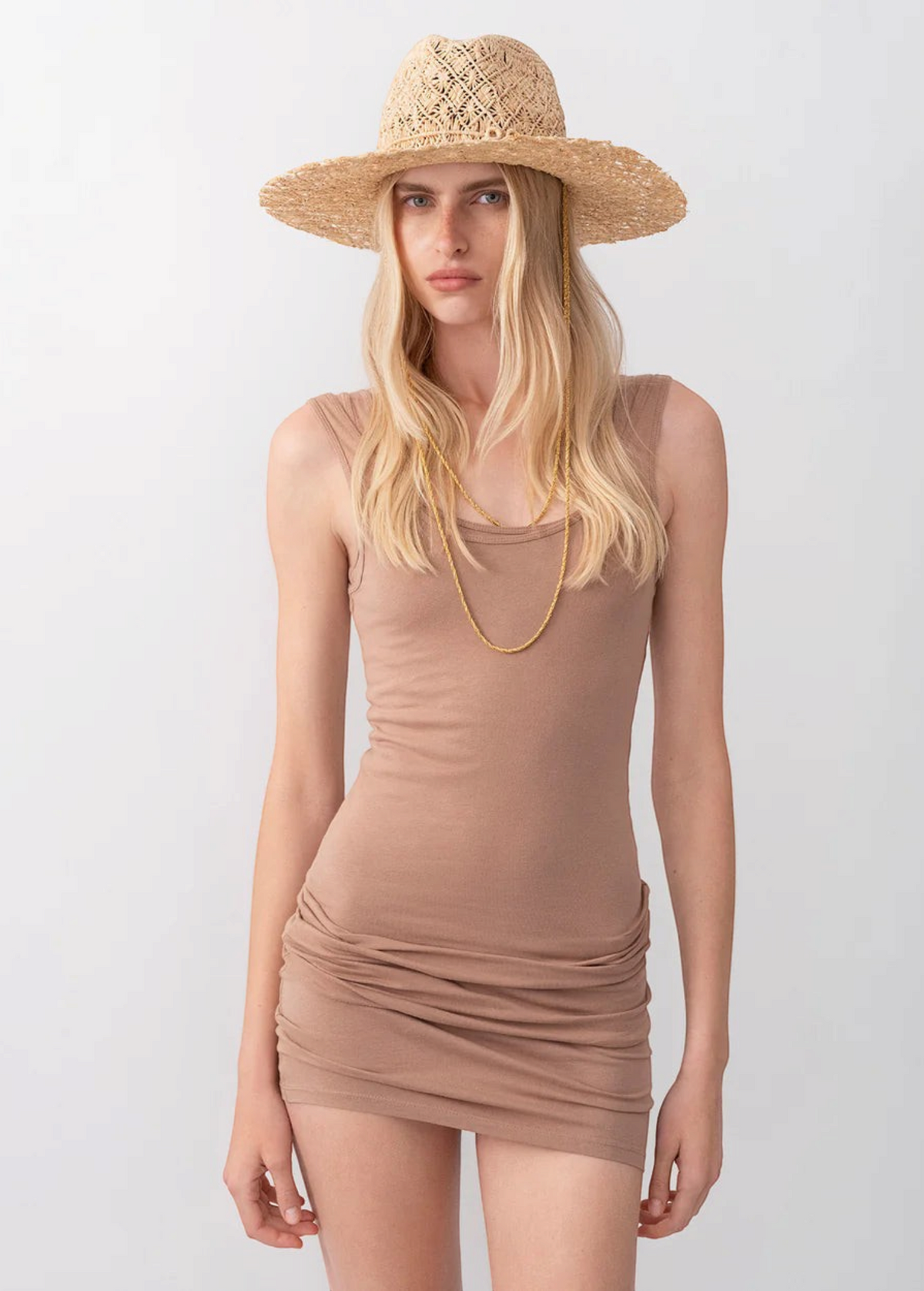 KABE SHOP INC straw fedora hat with cut-out design and gold double chain strap worn by a blonde model