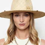 KABE SHOP INC straw fedora hat with gold chain strap and metallic accents worn by a woman against a white background