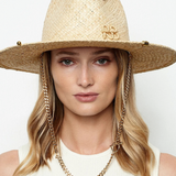 KABE SHOP INC straw fedora hat with gold chain strap and metallic accents worn by a woman against a white background