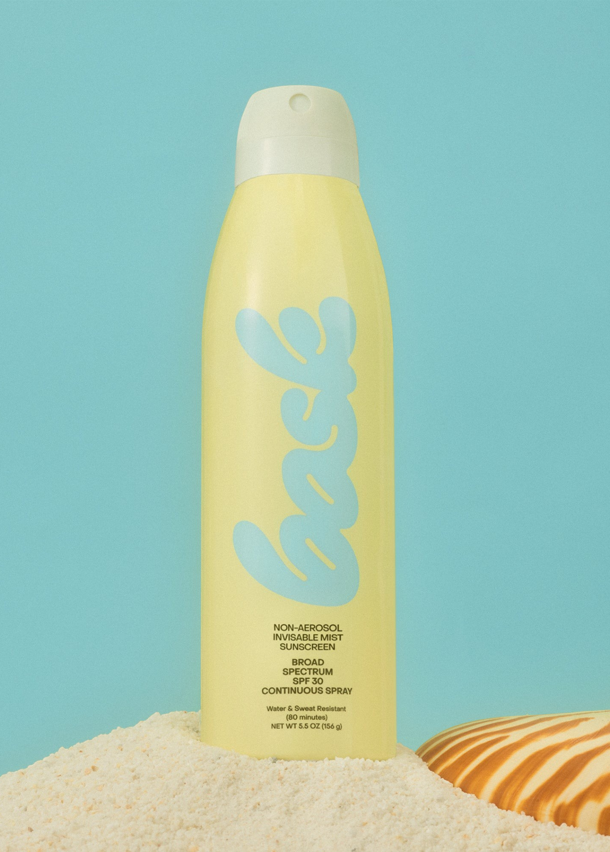 KABE SHOP INC non-aerosol SPF 30 sunscreen spray in a yellow bottle on sand with a seashell against a blue background