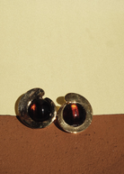 KABE SHOP INC tortoise stone earrings featuring a sculptural gold-plated frame and warm brown resin inlay.