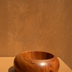 KABE SHOP INC set of three sculptural bangles made from natural wood and resin with a modern, minimalist design.