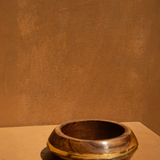 KABE SHOP INC set of three sculptural wood and resin bangles featuring a natural wood grain and gold resin detail.