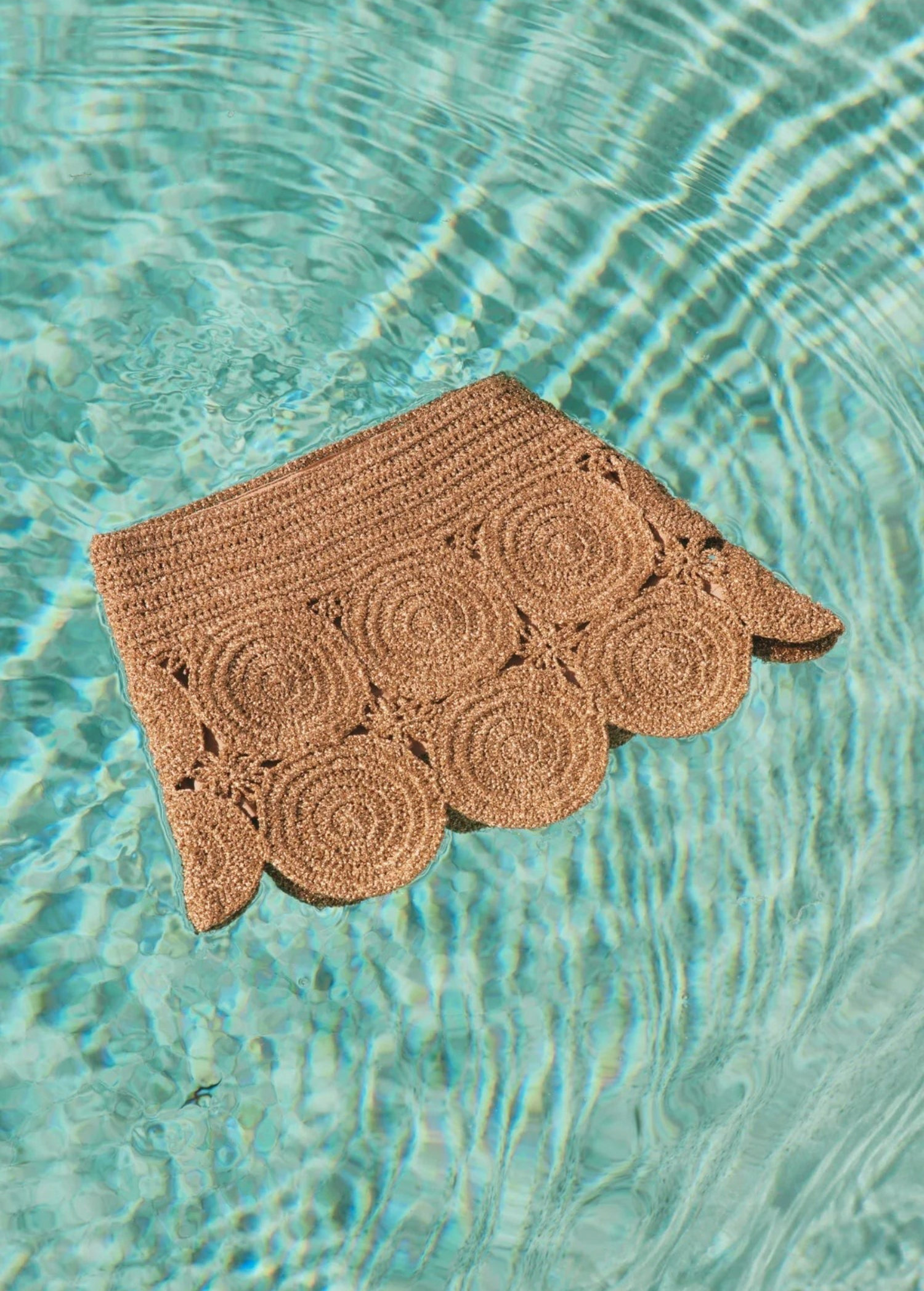 KABE SHOP INC Beep Beep mini skirt in metallic brown lurex crochet with circular medallion motifs in pool water.