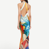 KABE SHOP INC Salpicon long silk dress with an open back, halter neck, and vibrant multi-colored abstract print.