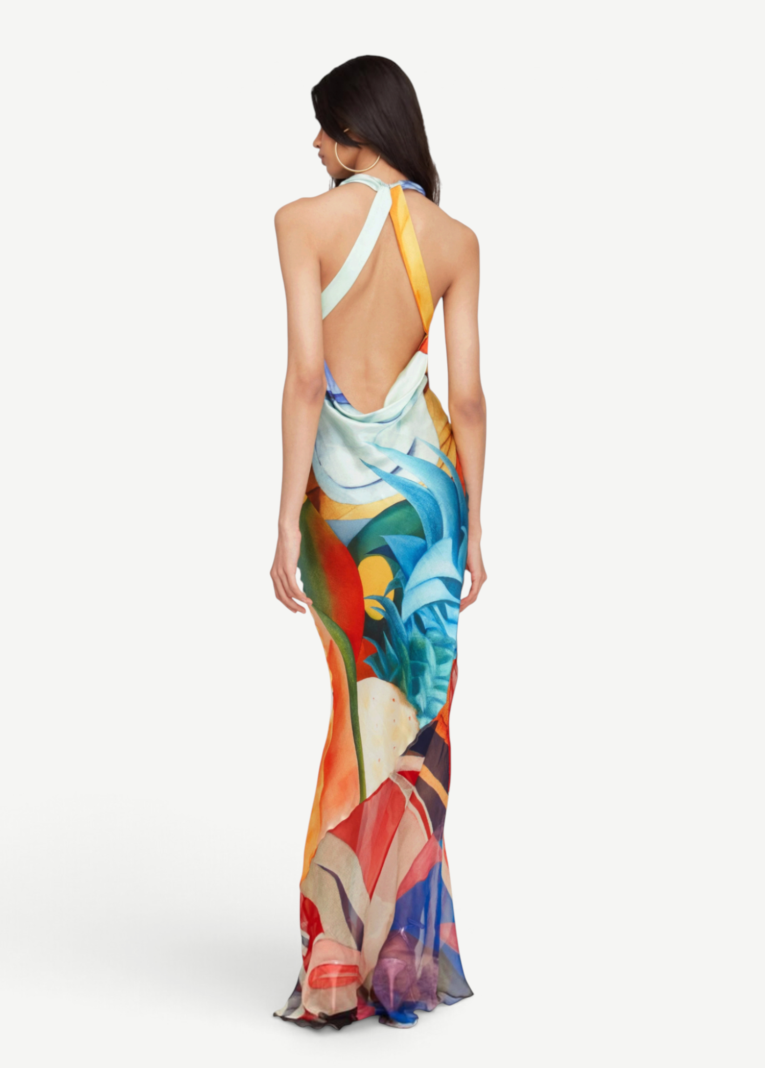 KABE SHOP INC Salpicon long silk dress with an open back, halter neck, and vibrant multi-colored abstract print.