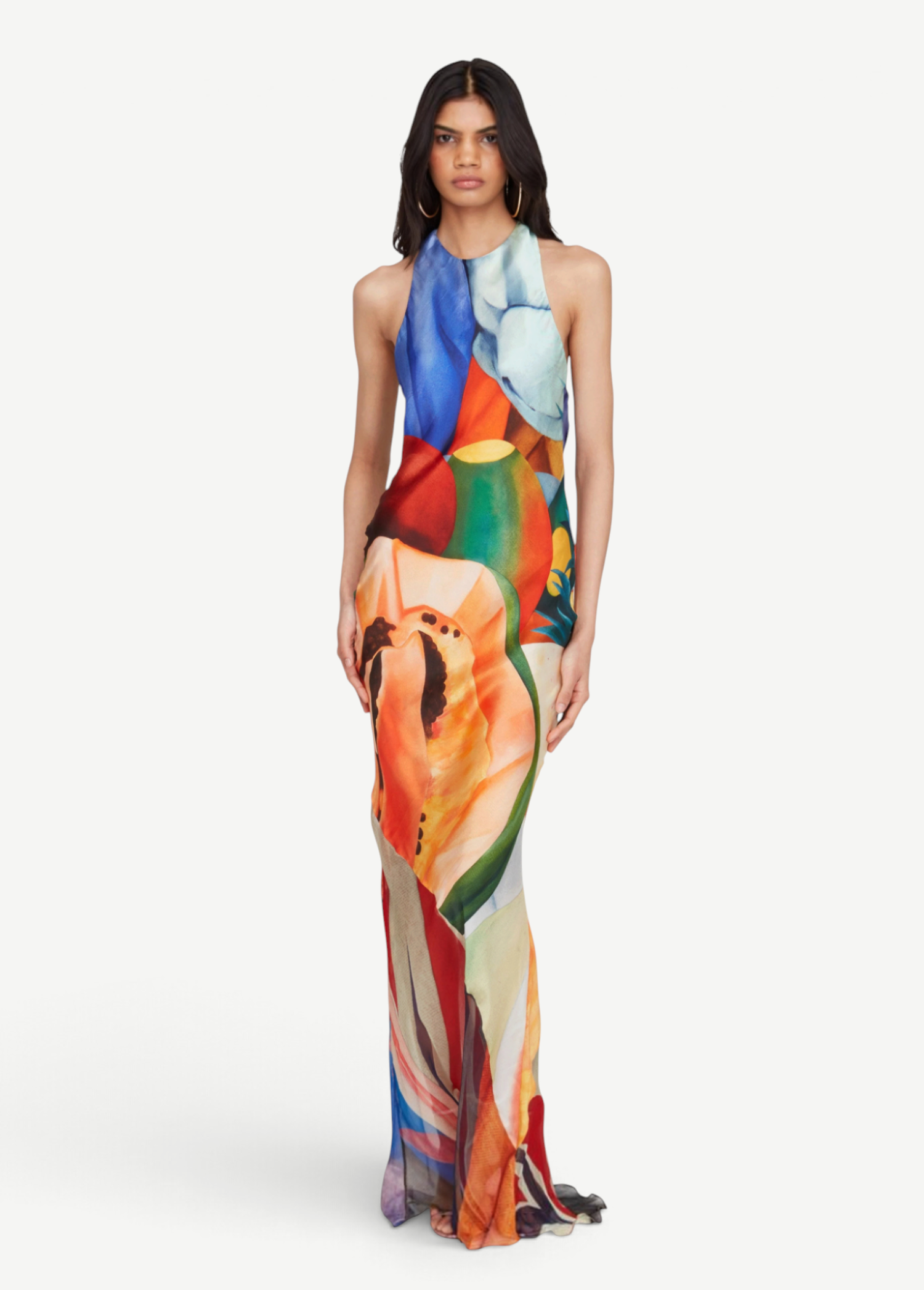 Model wearing KABE SHOP INC Salpicon long silk dress with vibrant multicolor fruit print and fluid halter neckline