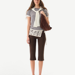 KABE SHOP INC Gianna pants featuring a brown polka dot pattern, flared silhouette, and white crochet waist detail.