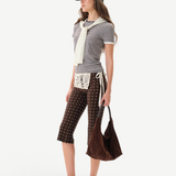 KABE SHOP INC Gianna pants in brown with white polka dots, featuring a crochet waist detail and flared silhouette.