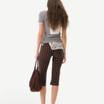 KABE SHOP INC Gianna pants in brown with white polka dots, featuring a flared silhouette and crochet waist detail.