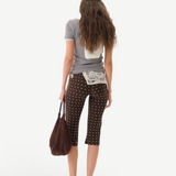 KABE SHOP INC Gianna pants in brown with white polka dots, featuring a flared silhouette and crochet waist detail.
