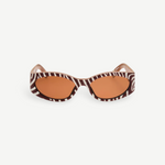 KABE SHOP INC Ovalo sunglasses featuring a bold zebra print oval frame and warm amber tinted lenses.