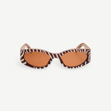 KABE SHOP INC Ovalo sunglasses featuring a bold zebra print oval frame and warm amber tinted lenses.